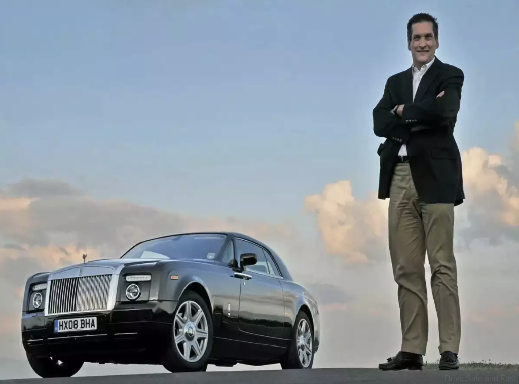 Ian Cameron next to rolls royce